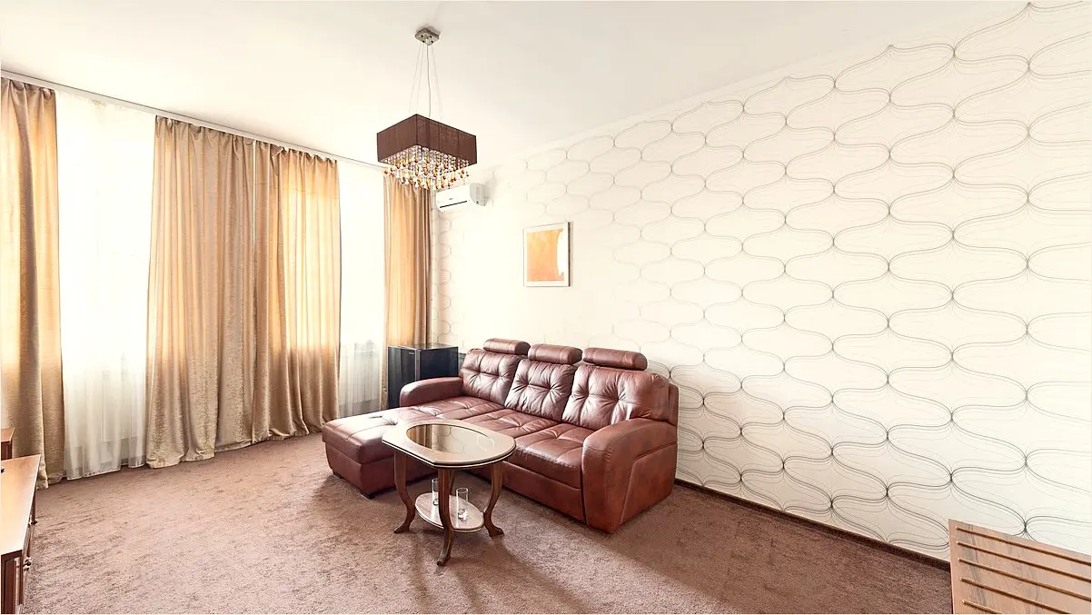 Elegant premium hotel room interior 'Standard' category in Saratov, king size bed with high-quality white linens, wooden furniture, warm evening lighting, soft textures, minimalist decor, 8k professional hospitality photography, cozy atmosphere.